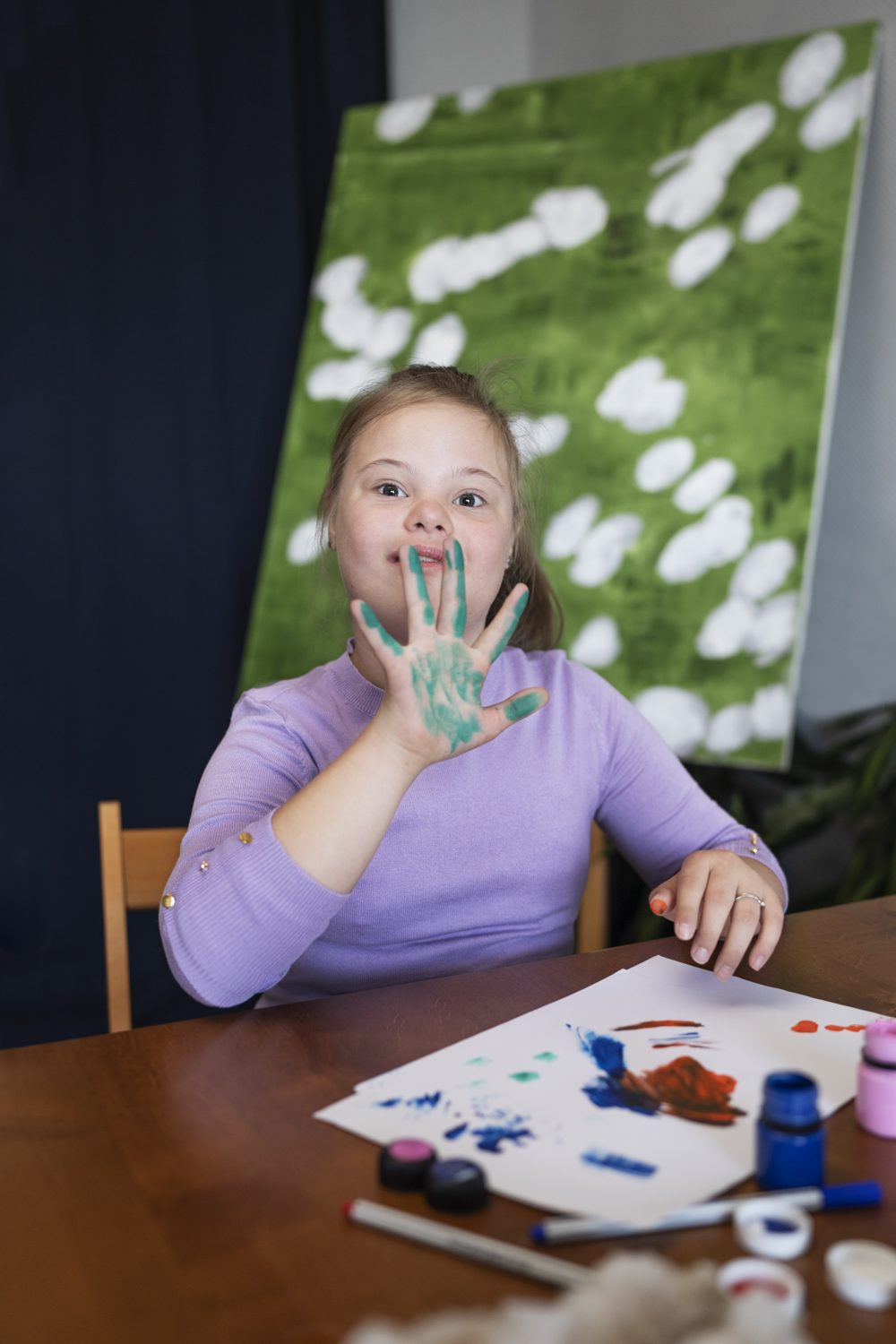 Girl painting proudly